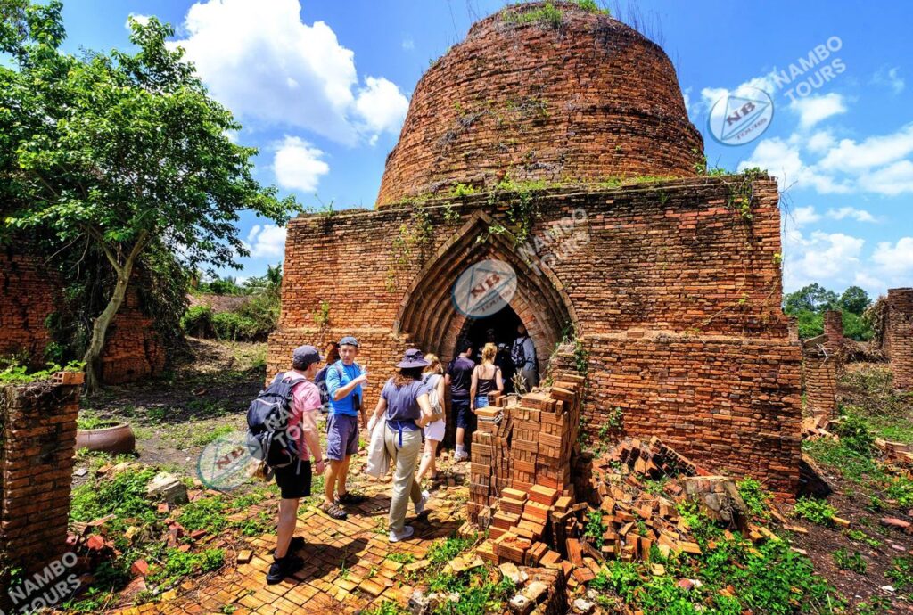 Visitors exploring an old brick kiln on a Ben Tre tour