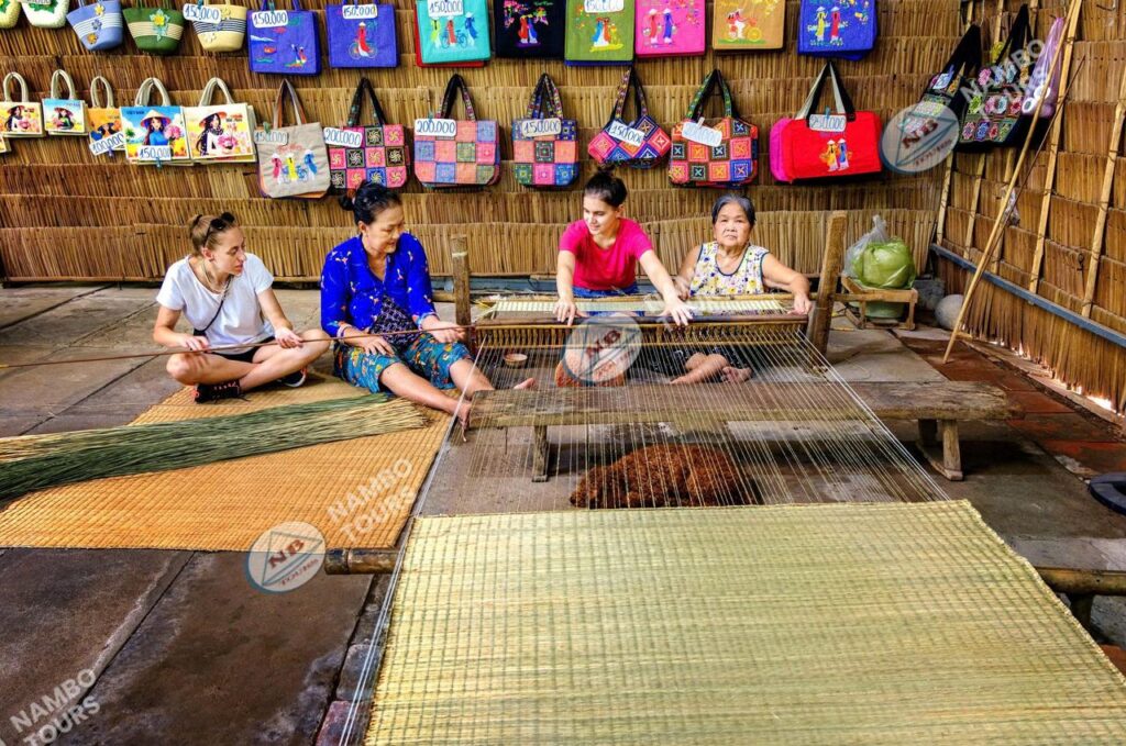 Local women weaving traditional sleeping mats in a Ben Tre village