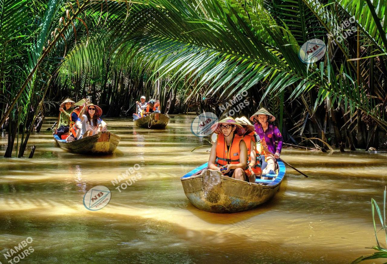 Private Ben Tre tour on a rowing sampan through a coconut canal in the Mekong Delta