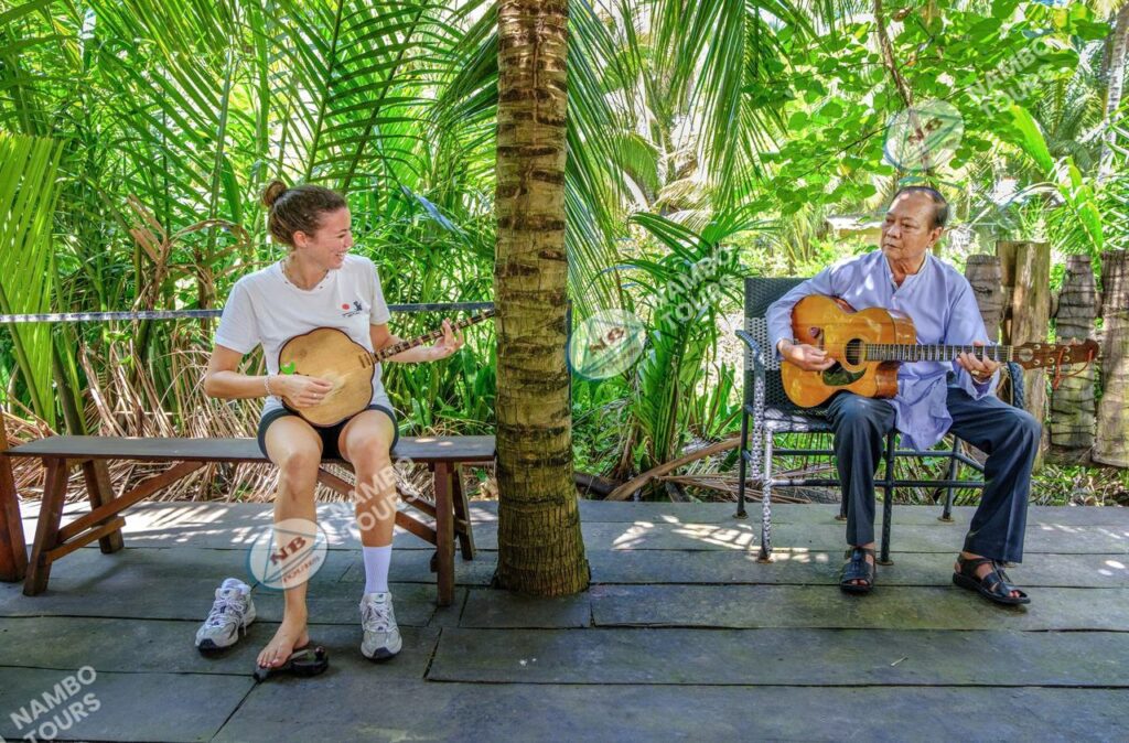 Đờn ca tài tử folk music performance in a riverside garden in Ben Tre